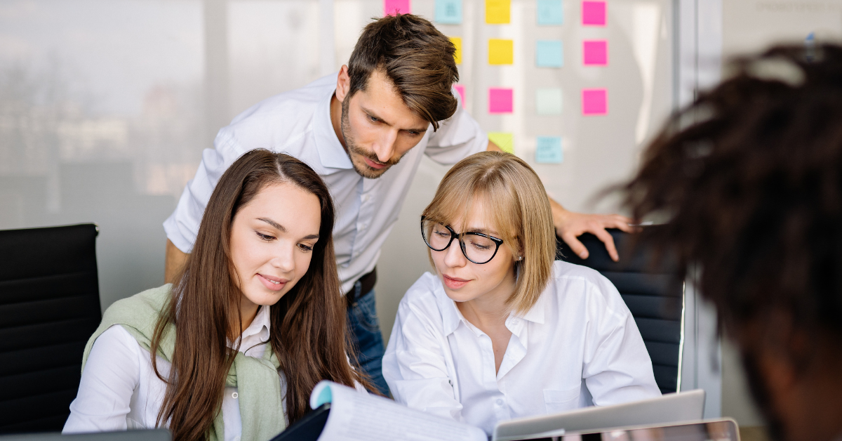 Employees collaborating in the office.